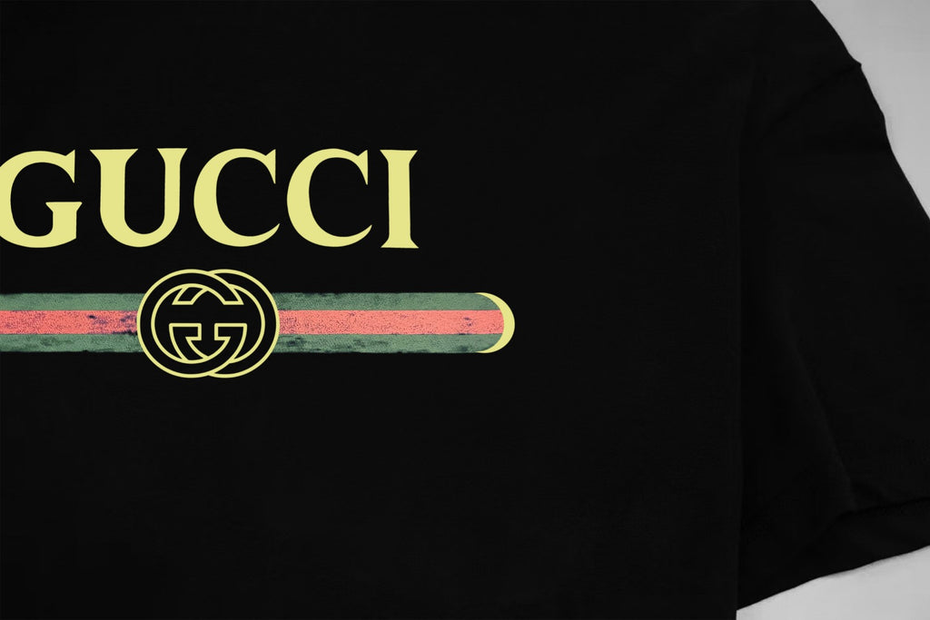 Black Gucci T-shirt with GUCCI wordmark and emblem chest print