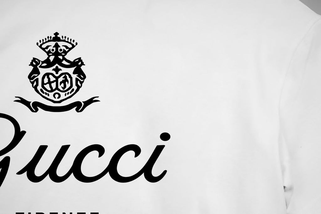 White T-shirt with black Gucci crest and script logo detail