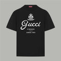 Black Gucci short-sleeve T-shirt with crew neck and white “Gucci” logo graphic
