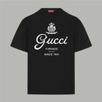 Black Gucci short-sleeve T-shirt with crew neck and white “Gucci” logo graphic