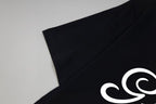 Black Gucci short-sleeve T-shirt with partial white “Gucci” logo on chest