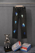 Black denim pants with multicolor cross patches, button fly and belt loops