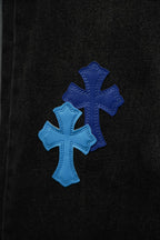 Black denim with two overlapping blue cross appliques