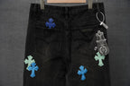 Black denim pants with cross patches on both legs, hang tag