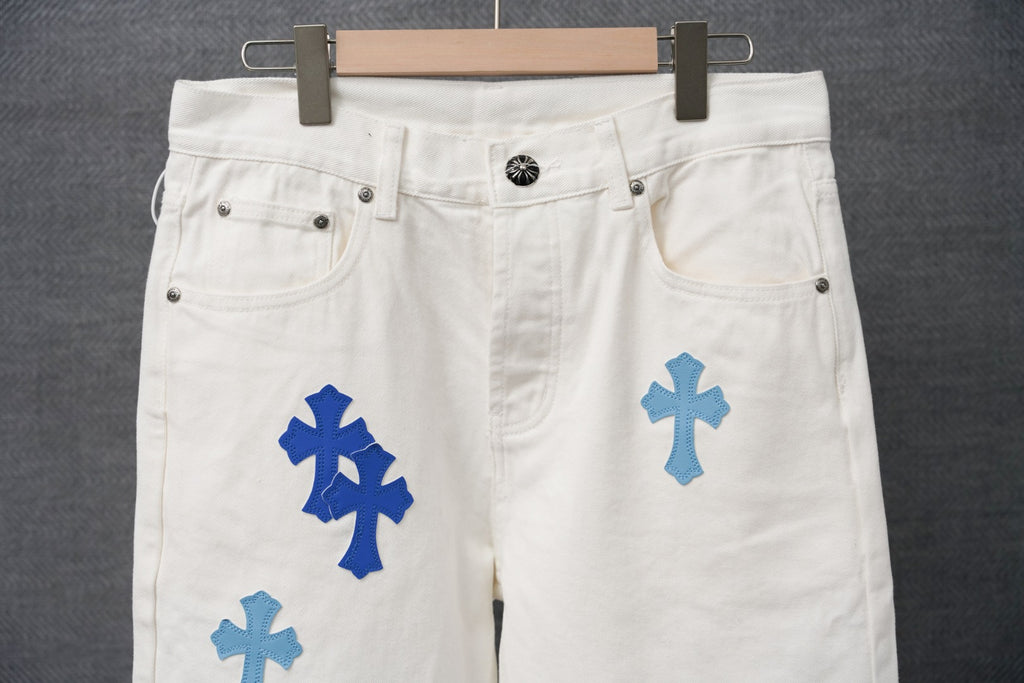 White denim pants with blue cross patch print, front button and zip fly