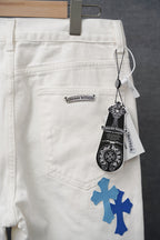 White pants with blue cross print and front logo patch, hanging tag