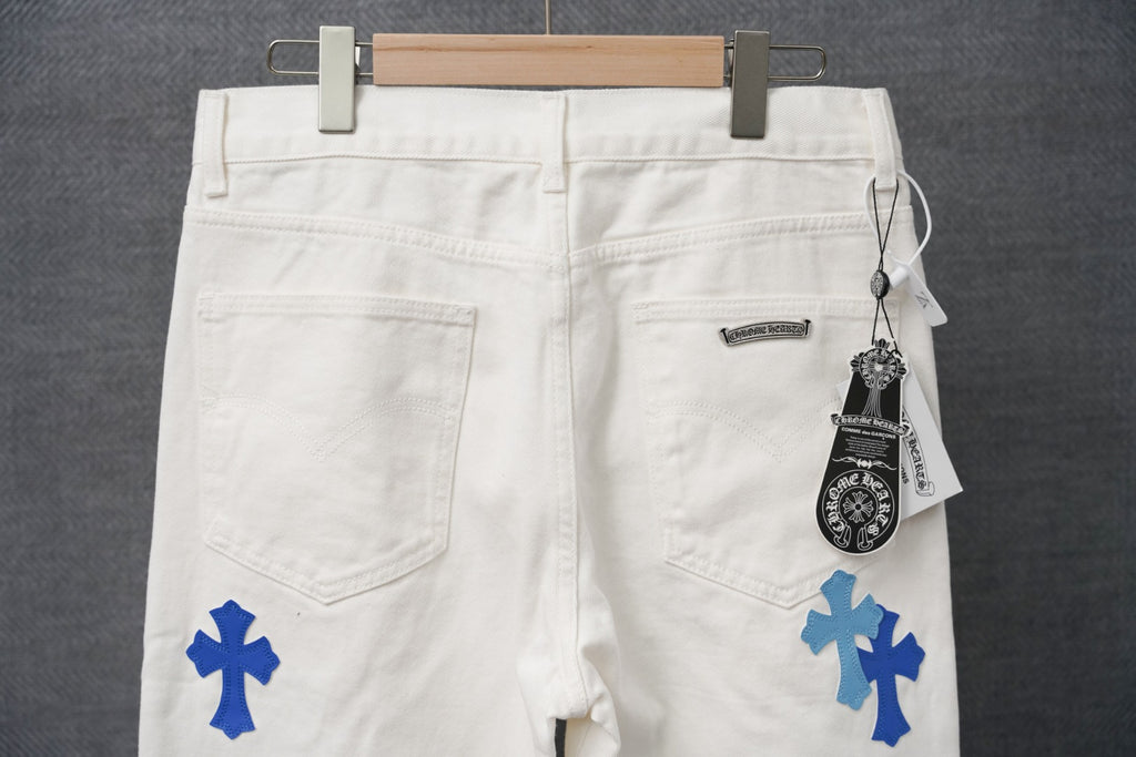 White pants with blue cross prints, zip fly and front pockets