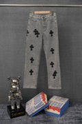 Gray denim pants with black cross patches, straight leg and button fly