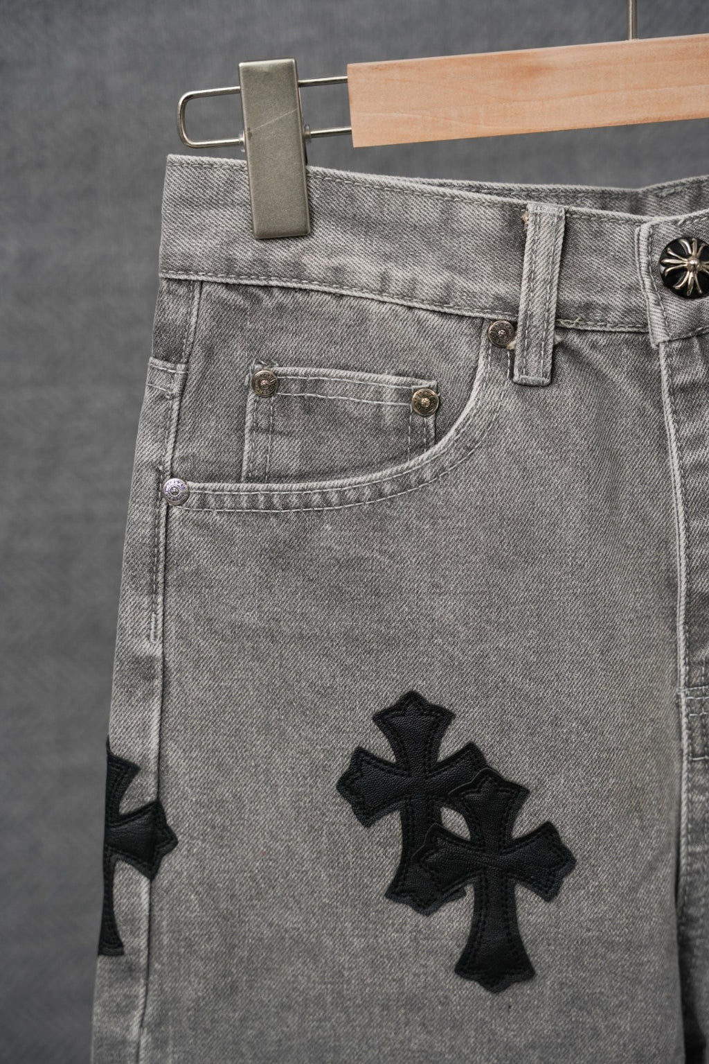 Chrome pants front pocket detail, light gray denim with black cross patch