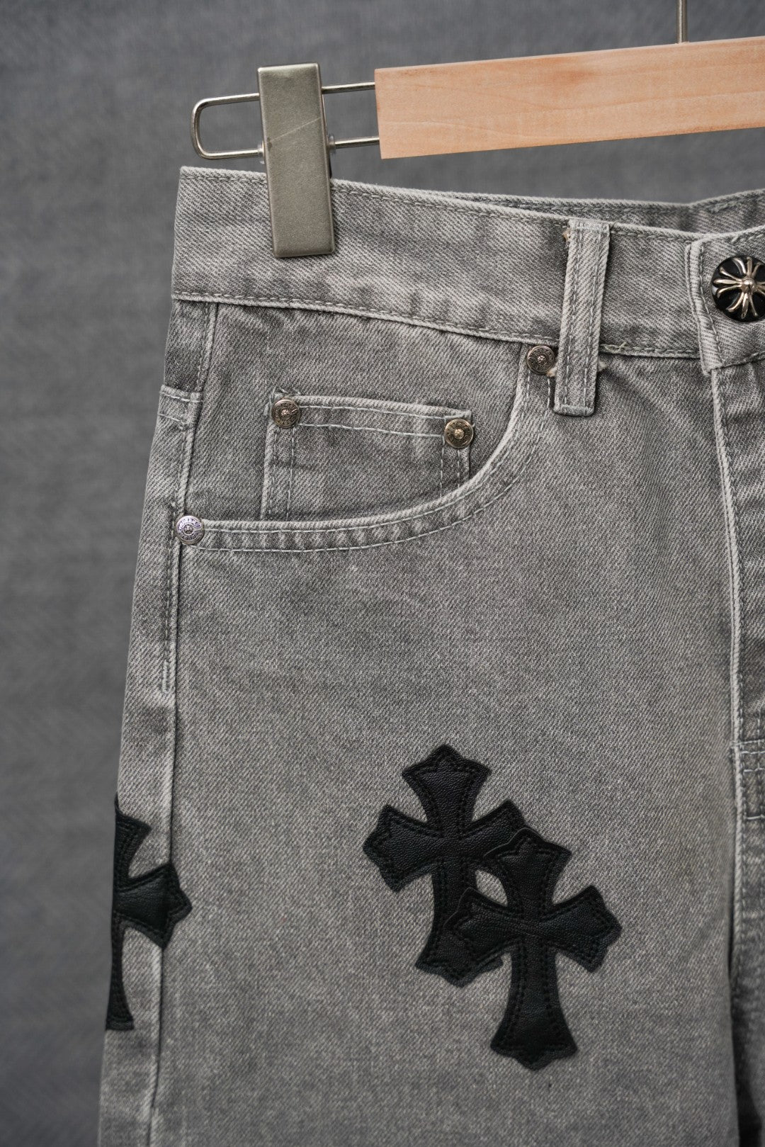 Chrome pants front pocket detail, light gray denim with black cross patch
