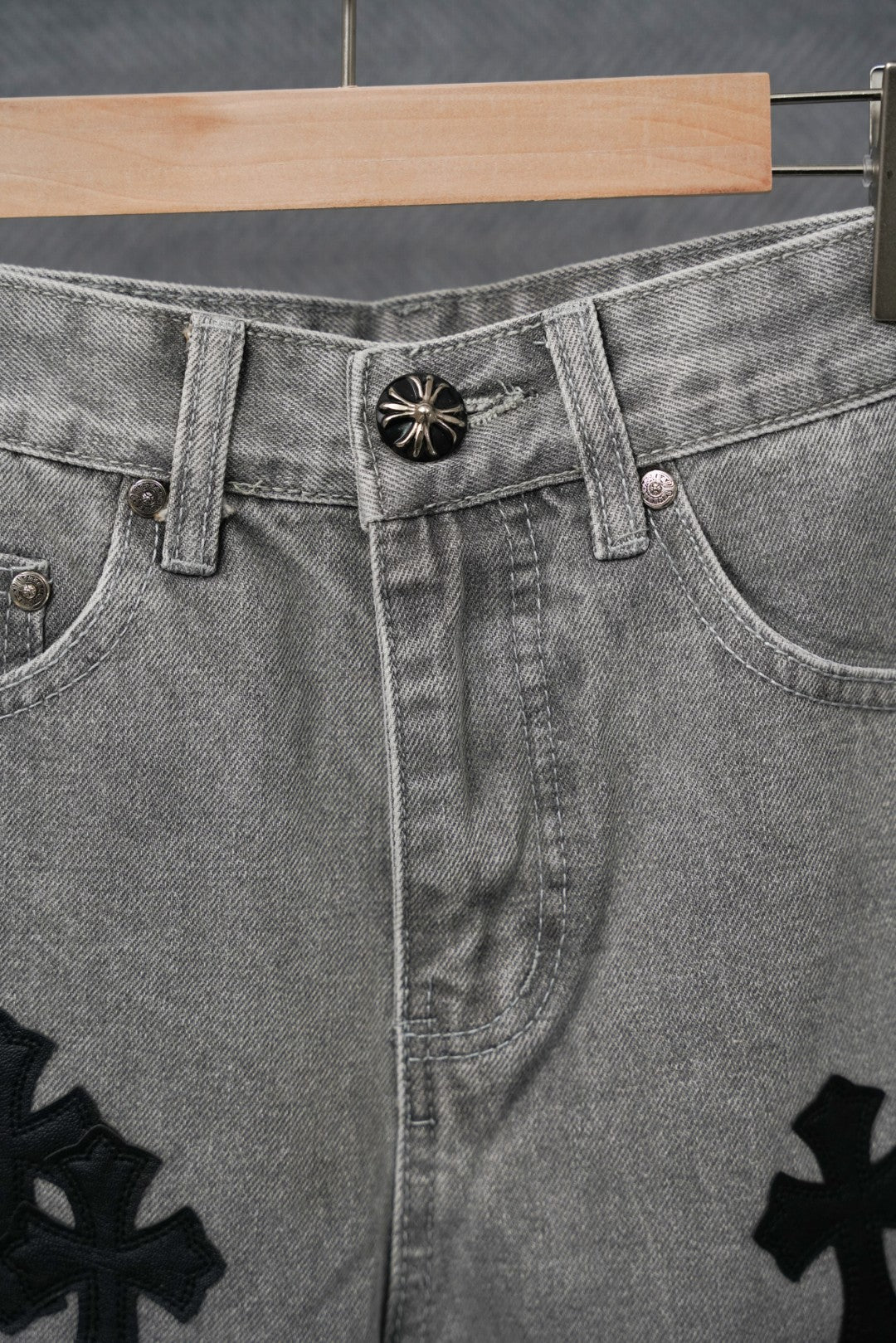 Chrome pants waistband detail, light gray denim with black cross patch