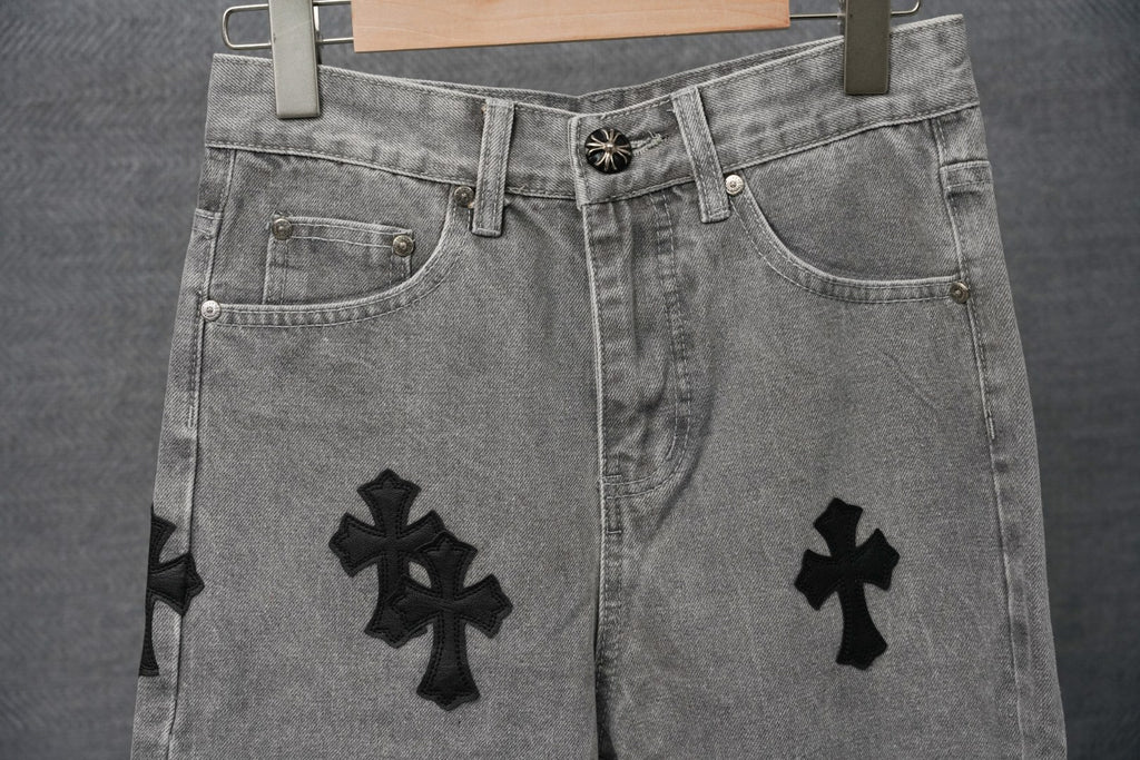 Chrome pants back view, light gray denim with black cross patches