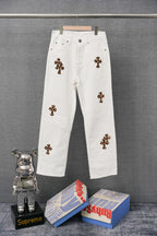 White denim pants with leopard-print cross patches on the legs