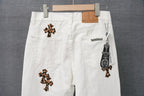 White pants flat view with leopard-print cross patches and zippered right pocket