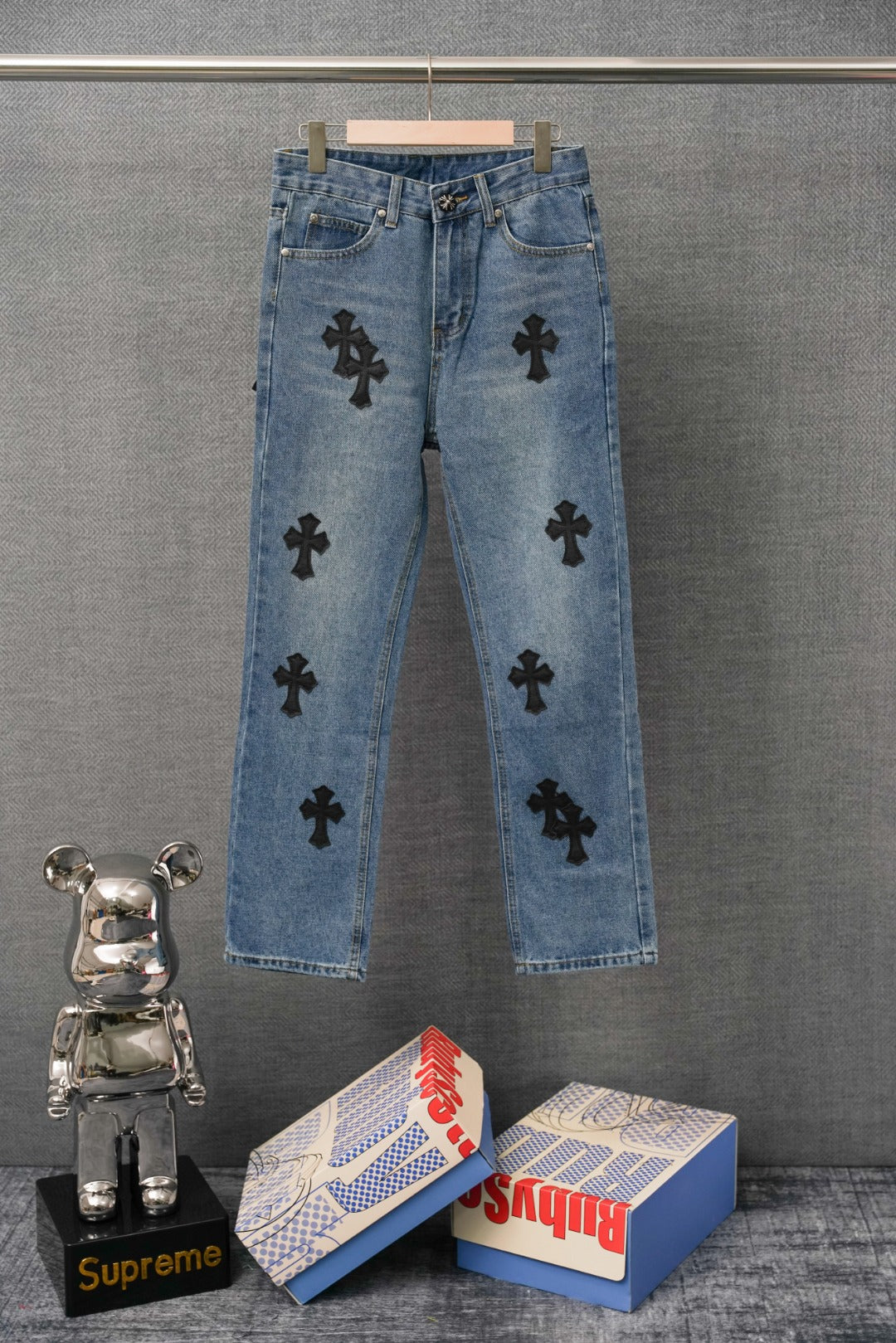 Blue denim Chrome pants with black cross patches, straight leg, button fly.