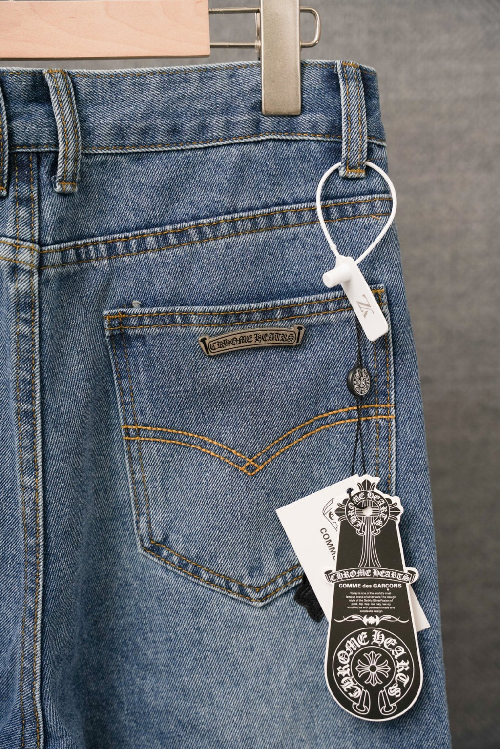 Light blue denim pants, front pocket and waistband with hanging price tags