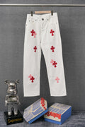 White denim pants with red cross patch graphics, front view