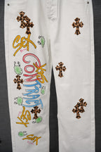 White denim pants with leopard-print cross patches and colorful vertical text graphic