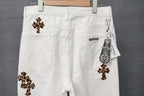 White denim pants with leopard-print cross patches and a small metal logo tab