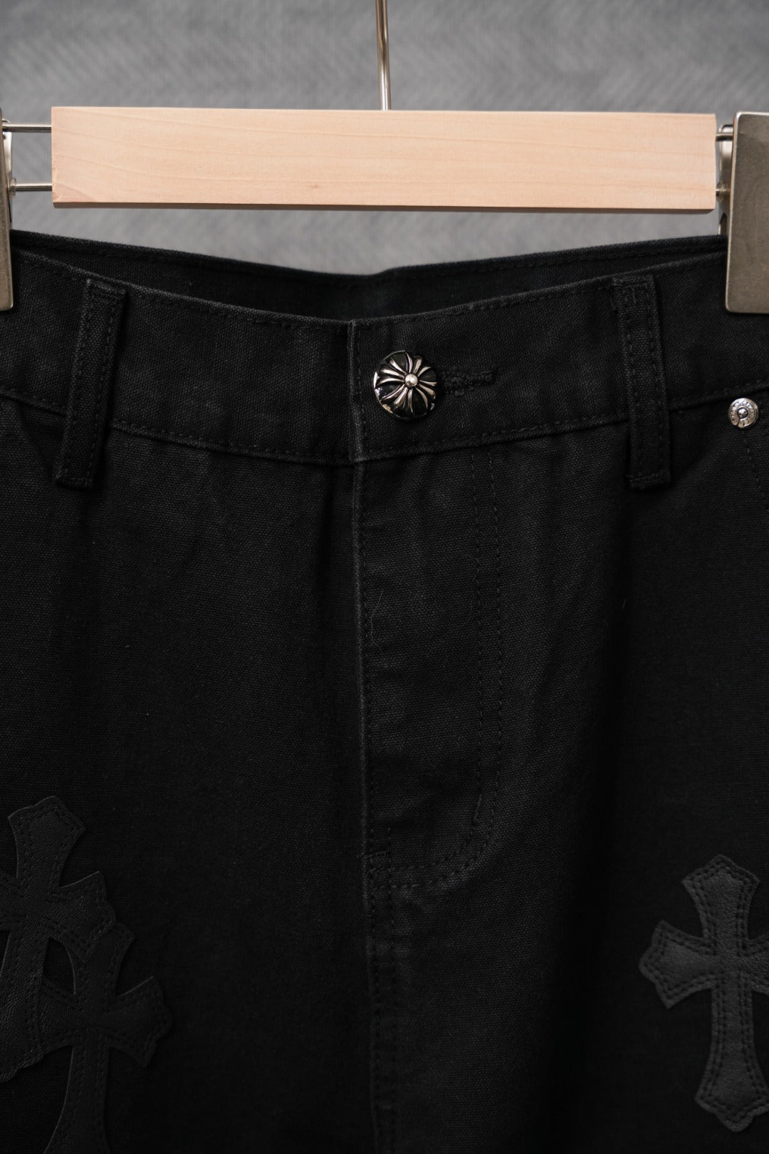 Black chrome pants with waistband button and cross embroidery patches