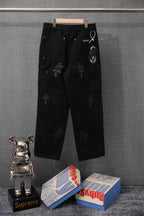 Black chrome pants with cross embroidery, drawstring waist detail, back view