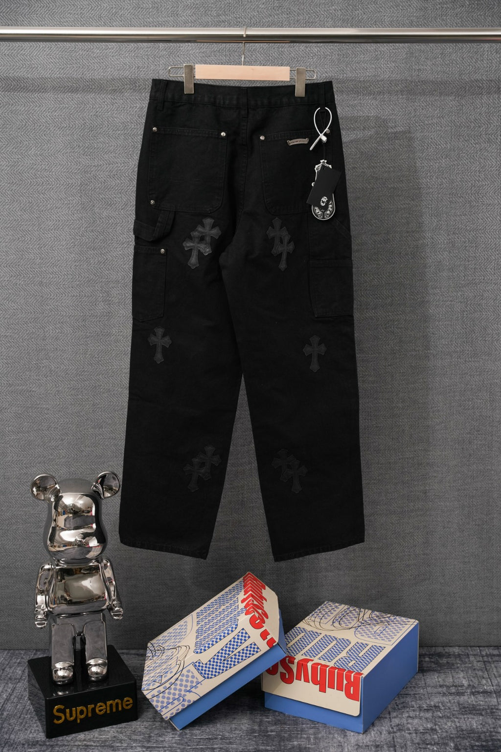Black pants with cross pattern, drawcord waist, and side pockets