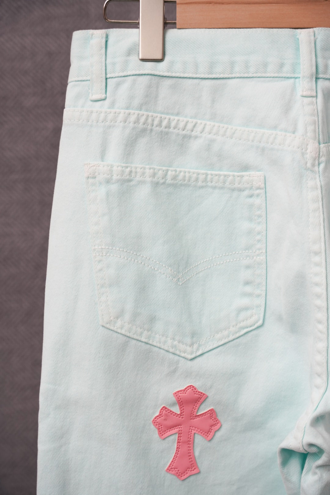 Light blue pants with back patch pocket and red cross applique