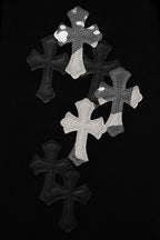 Black fabric with large white cross appliqué cluster
