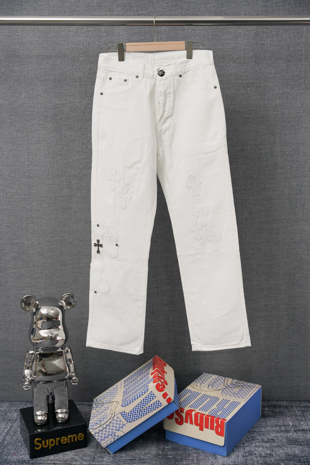 Chrome white denim pants with button-fly and side pockets, front view