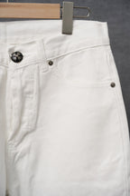 White pants front view with belt loop, coin pocket, and button hardware
