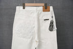 White pants back view with stitched logo detail and buttoned pocket