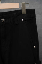 Black pants close-up of front panel, belt loop, and button