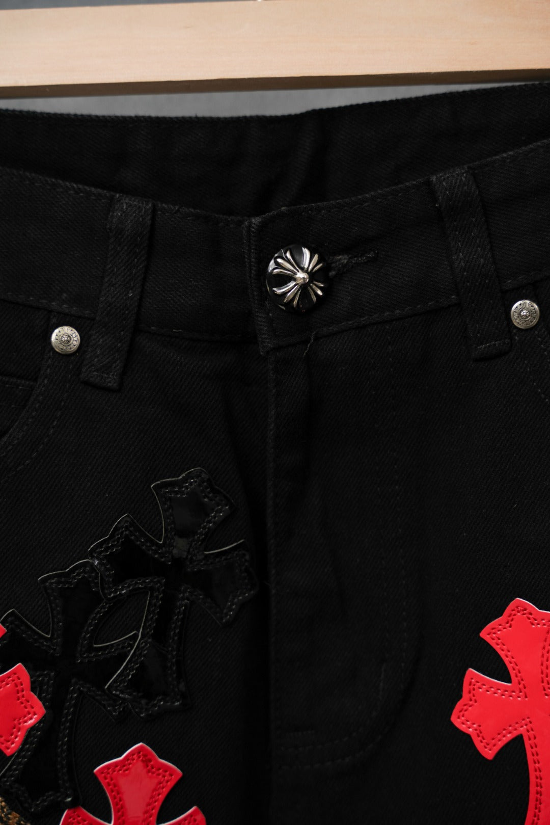Black Chrome pants waistband with button closure and red cross applique