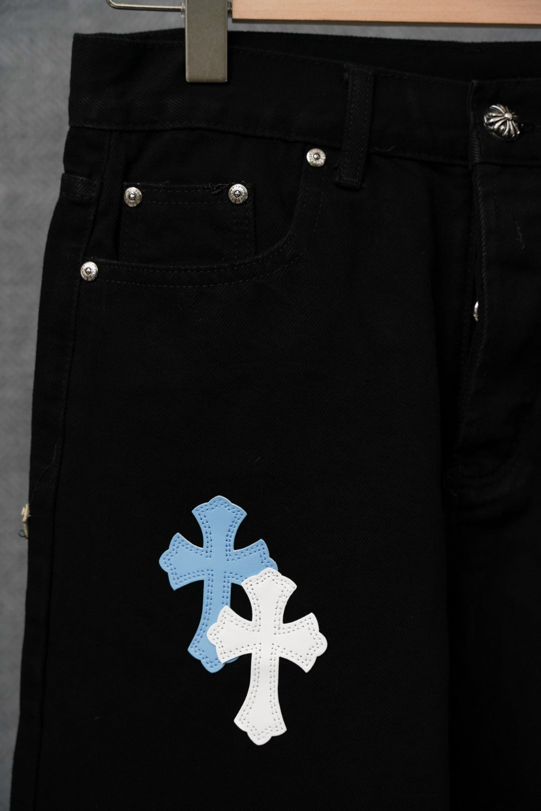Chrome pants, black with light blue cross patch on front pocket area