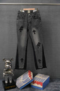 Dark denim pants with embroidered cross symbols and front pockets