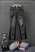 Dark denim pants with embroidered cross symbols and front pockets