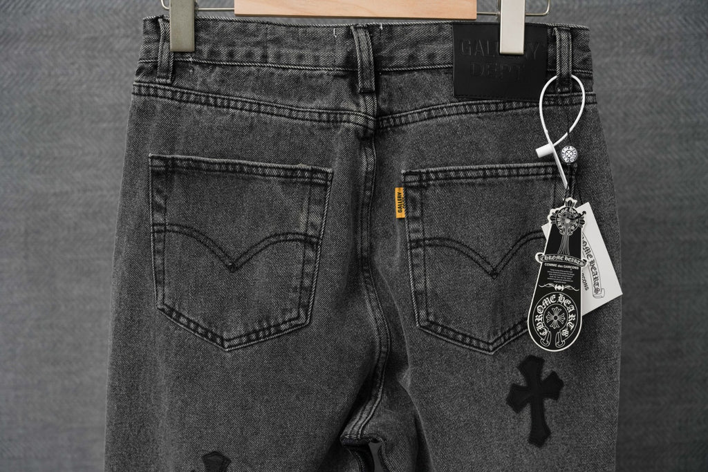 Dark denim pants with heart back pockets, button fly, and hanging tag