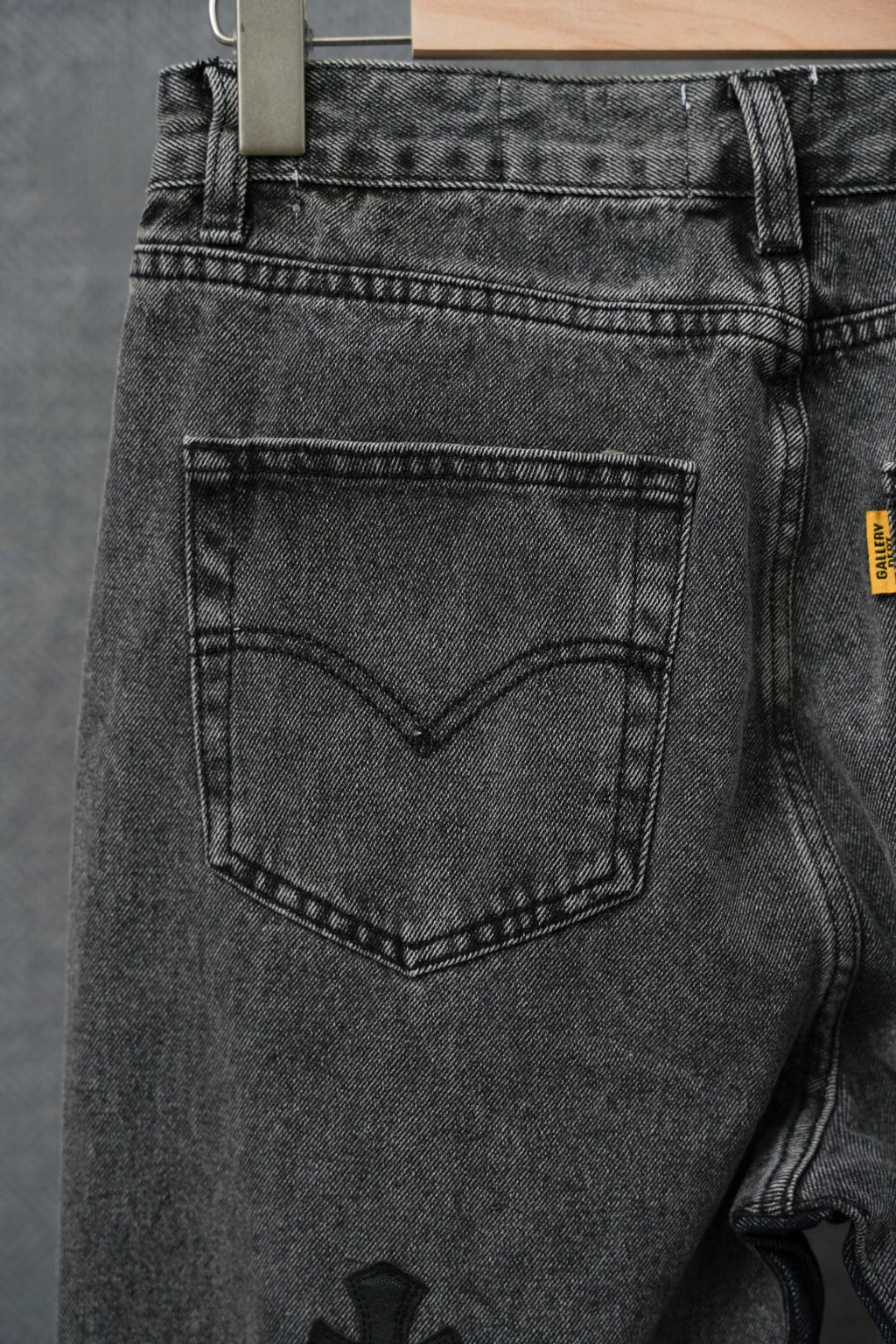 Black denim pants with squared front pocket and belt loops