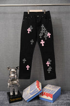 Black pants with pink and checkered cross patches, button fly, belt loops
