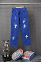 Chrome pants in blue with embroidered cross patches, belt loops, and front pockets