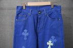 Blue Chrome pants front view with belt loops, two front pockets, and cross patches
