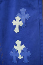 Blue Chrome pants leg with large cross applique and smaller cross patches