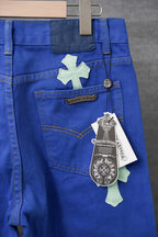 Chrome pants front view in blue with cross patches, stitched details, and hanging tag
