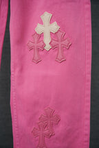 Pink denim pants with three cross appliques on front leg