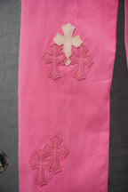 Pink pants side with small stitched cross appliques
