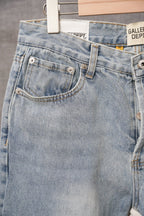 Light blue denim jeans rear waistband with belt loops and button