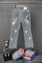 Light wash denim pants with white cross patches and side tag detail