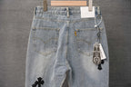 Light wash denim jeans with front pockets and keychain tag on waistband
