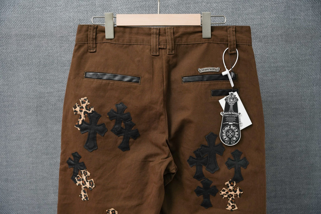 Brown pants with back pockets and cross patches in dark with leopard-print accents