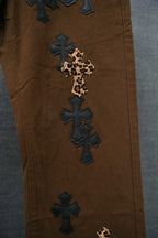 Brown pants with leopard-print cross applique and dark blue cross patches